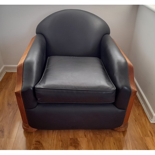 489 - An Art Deco style black leatherette Three Piece Suite, with reeded light wood arms and replacement u... 