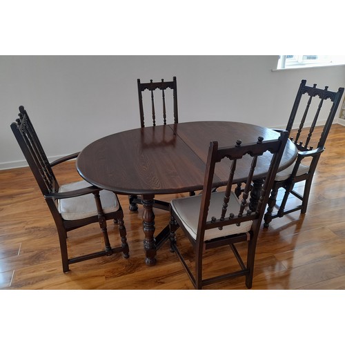 490 - An Ercol 'Old Colonial' extending Dining Table, together with four Ercol 'Old Colonial' dining chair... 