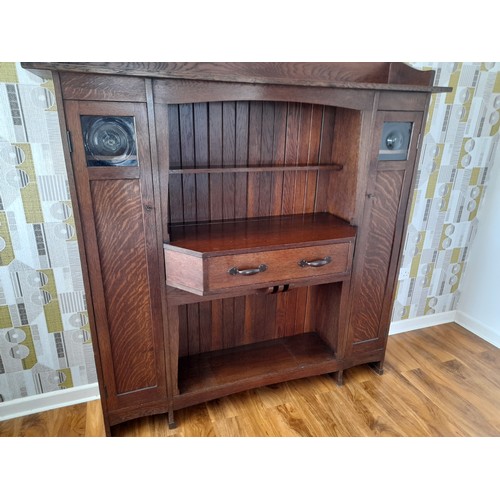 488 - A Liberty & Co Arts and Crafts oak 'Hathaway' Dresser, c1900, with central shelf and drawer flan... 