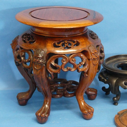 142 - A small quantity of Oriental hardwood Stands, to include a good quality rosewood stand with incised ... 