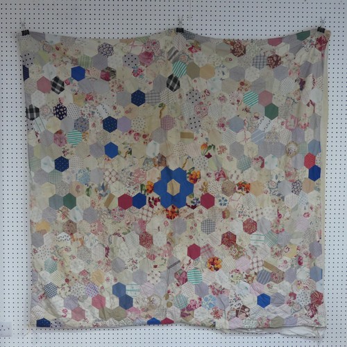 452 - An early 20thC hand-stitched Patchwork Quilt, formed of hexagonal pieces of fabric each 9.5cm, backe... 