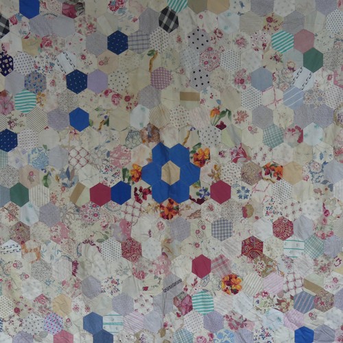 452 - An early 20thC hand-stitched Patchwork Quilt, formed of hexagonal pieces of fabric each 9.5cm, backe... 