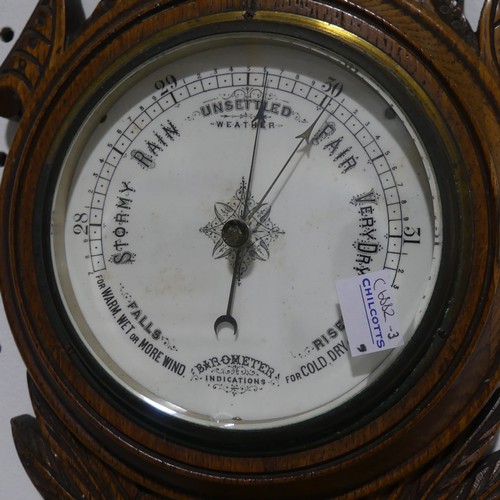 429 - An Edwardian aneroid  Barometer / Thermometer, in carved oak case, 66cm high, together with a Victor... 