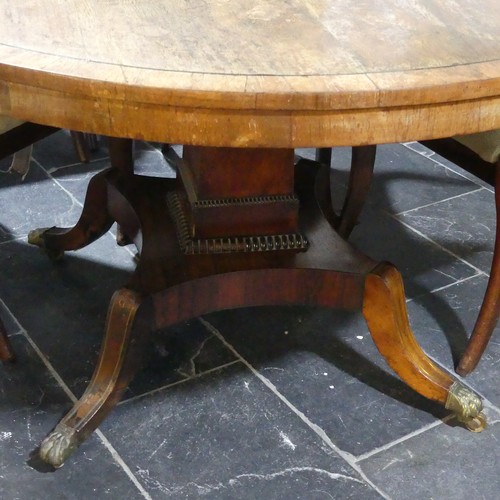 436 - An early 19thC rosewood circular tilt-top Breakfast Table, on brass-inlaid concave platform raised o... 