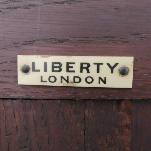 488 - A Liberty & Co Arts and Crafts oak 'Hathaway' Dresser, c1900, with central shelf and drawer flan... 