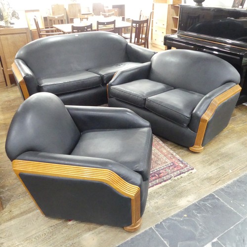 489 - An Art Deco style black leatherette Three Piece Suite, with reeded light wood arms and replacement u... 