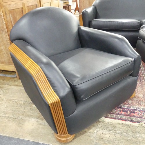 489 - An Art Deco style black leatherette Three Piece Suite, with reeded light wood arms and replacement u... 