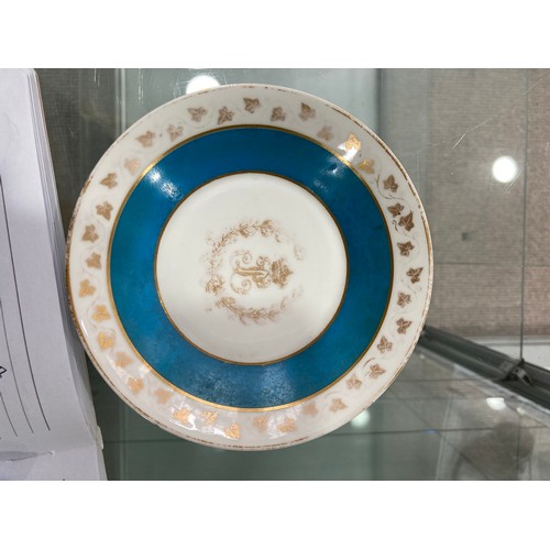 138 - A Sevres-style 'Chateau des Tuileries' Cabinet Cup and Saucer, in blue ground with gilt decoration, ... 