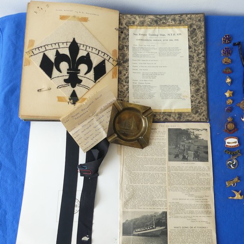 140 - A collectors lot including a mid 20thC Girl Guide scrap book, badges, ribbons etc., together with an... 