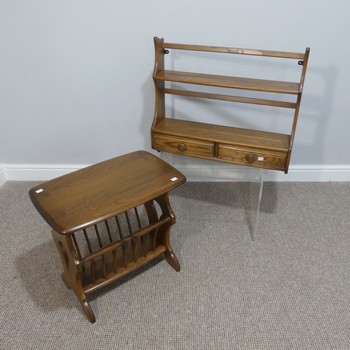 524 - An Ercol dark oak Canterbury Occasional Table, with an oblong top, raised on trestle ends, joined by... 