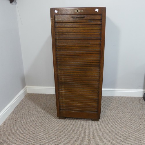 528 - An early 20thC oak pedestal Filing Cabinet, with locking full tambour front exposing the nine tray s... 