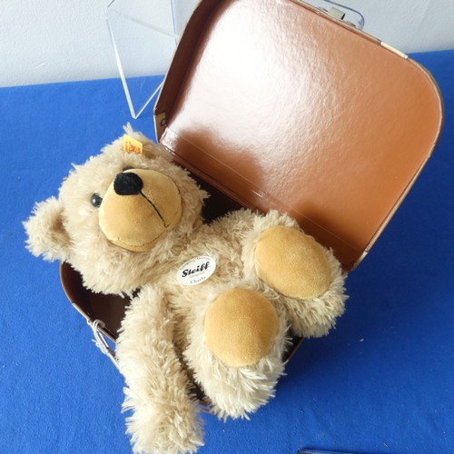 178 - A Steiff Charly bear in Suitcase box, H 24cm approx, serial number 012938, together with a vintage p... 