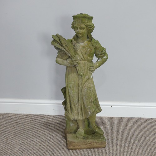 551 - Garden statuary; a reconstituted stone figure of a woman carrying wheat, H 79cm