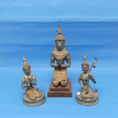 530 - A Tibetan figure of a kneeling High Priest, on stepped wooden base, together with two similar figure... 