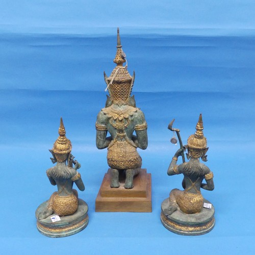 530 - A Tibetan figure of a kneeling High Priest, on stepped wooden base, together with two similar figure... 