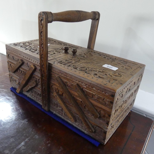 532 - A 20thC cantilever Sewing Box, with carved decoration and contents, 41cm wide, together with a wood ... 