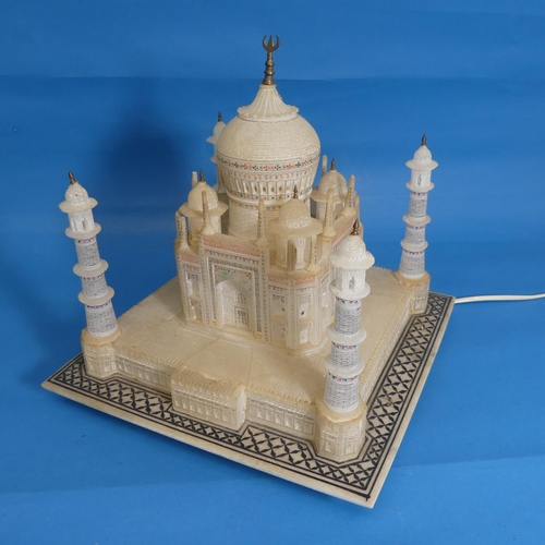 534 - Alabaster lamp in the form of the Taj Mahal, raised on square base with geometric border pattering, ... 