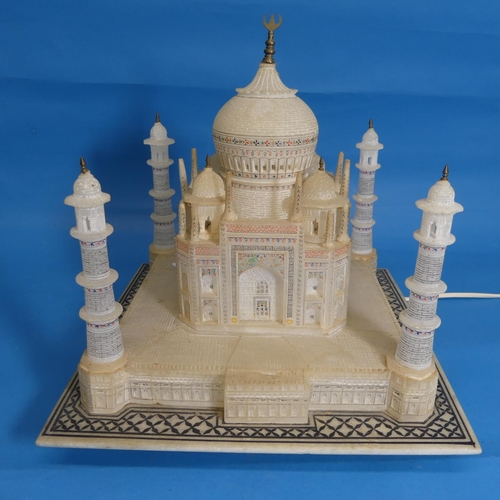 534 - Alabaster lamp in the form of the Taj Mahal, raised on square base with geometric border pattering, ... 