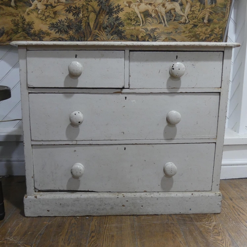 538 - A Victorian white painted pine Chest of Drawers, with two short and two long drawers, graduated in s... 