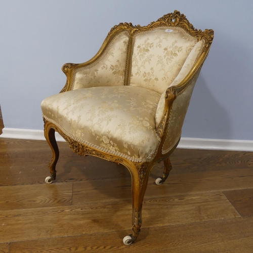 542 - A 19thC French gilt painted wood framed Salon Chair, with ornate carving and moulding to the the fra... 