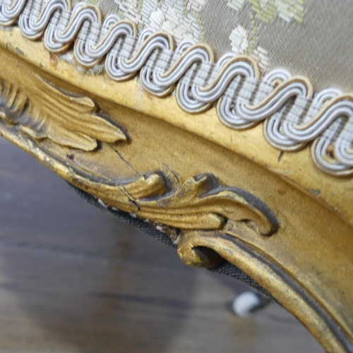 542 - A 19thC French gilt painted wood framed Salon Chair, with ornate carving and moulding to the the fra... 