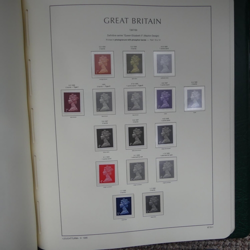 64 - Stamps; A QV to QEII mainly used collection of Great British Stamps, in four boxed Lighthouse albums... 