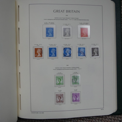 64 - Stamps; A QV to QEII mainly used collection of Great British Stamps, in four boxed Lighthouse albums... 