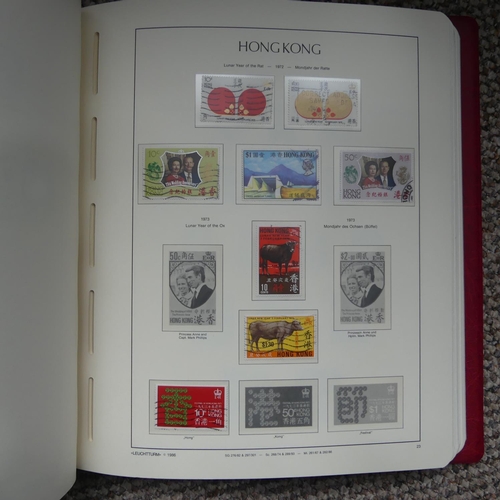 65 - Stamps; A collection of Stamps in eight albums, with mint and used British Empire including Falkland... 