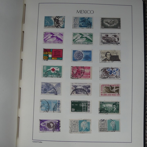 65 - Stamps; A collection of Stamps in eight albums, with mint and used British Empire including Falkland... 