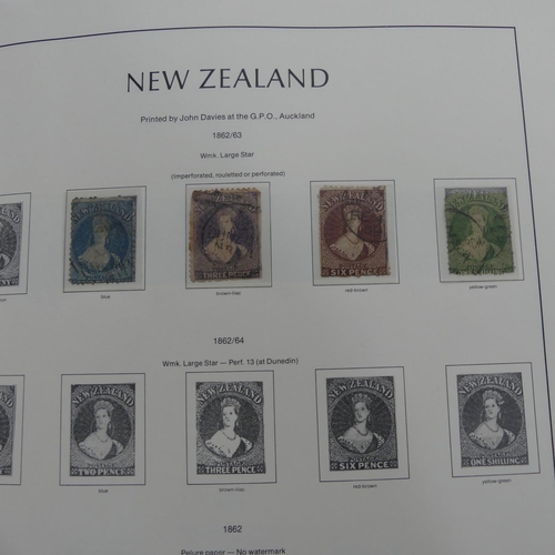 67 - Stamps; A QV to QEII mint and used collection of New Zealand Stamps, in a lighthouse album including... 