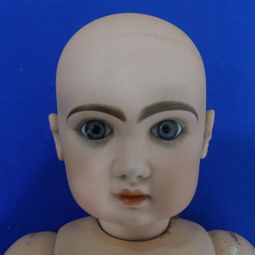 180 - A Bebe Jumeau bisque head doll, French c.1890's, with fixed blue glass eyes, painted lashes and brow... 