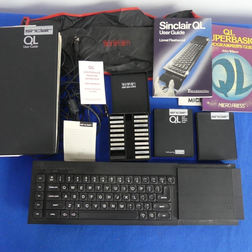 91 - A Sinclair QL computer, together with a box of tapes, easel software, paperwork and accessories ( a ... 