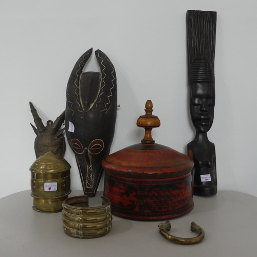 119 - An African bronze mask possibly Benin, together with African brass  slave bracelets and African deco... 