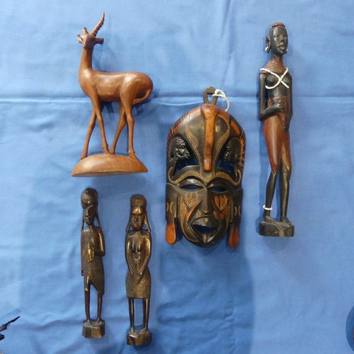 139 - A Collection of tribal items, including a wooden spear head, an African seed pod, together with a co... 