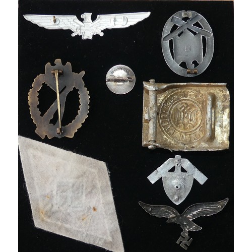 371 - A collection of reproduction German WW2 period Badges and Insignia, including an Infantry Assault Ba... 