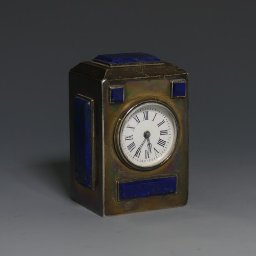 A Victorian silver miniature Desk Clock, by Charles & George Asprey, hallmarked London, 1895, of rectangular form inset with panels of lapis lazuli, one cracked, circular white enamel dial with Roman Numerals, 7.5cm high.