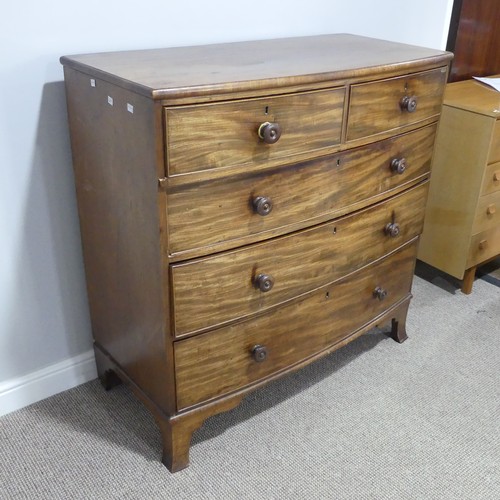 335 - A Georgian mahogany bow-front Chest of Drawers, with two short above three long drawers, graduated i... 