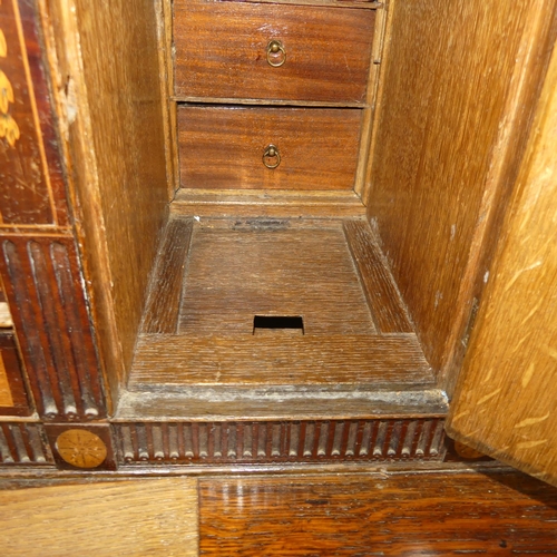 341 - A George III oak Bureau, the fall front enclosing a inlaid fitted interior, raised on four drawers, ... 