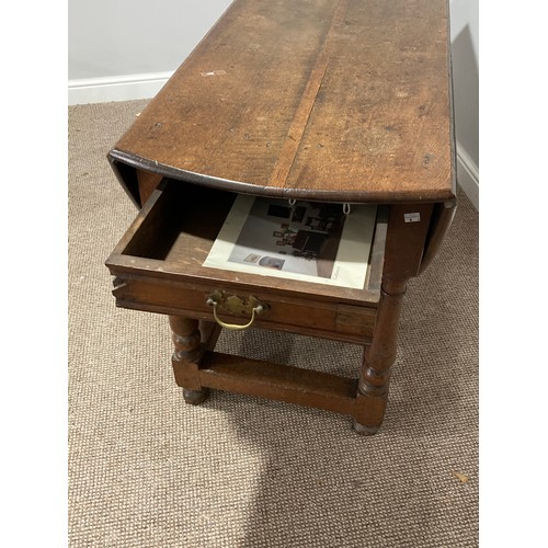 344 - An Oak Gateleg Table, with a drawer to either end on turned legs, split to top, W 149cm x D 130cm x ... 