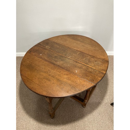 344 - An Oak Gateleg Table, with a drawer to either end on turned legs, split to top, W 149cm x D 130cm x ... 