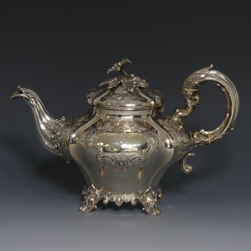 A Victorian silver Teapot, by Charles Reily & George Storer, hallmarked London, 1843, of melon form with elaborate foliate decoration, raised on a shell capped scrolled cast support, leaf capped scroll handle with ivory insulators, the hinged lid with cast foliate finial, 18.5cm approx total weight 23.8ozt.