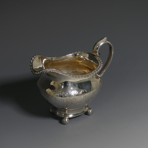 392 - A Victorian silver Cream Jug, by William Hunter, hallmarked London, 1848, of oval form with gad... 