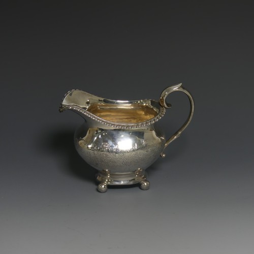 392 - A Victorian silver Cream Jug, by William Hunter, hallmarked London, 1848, of oval form with gad... 