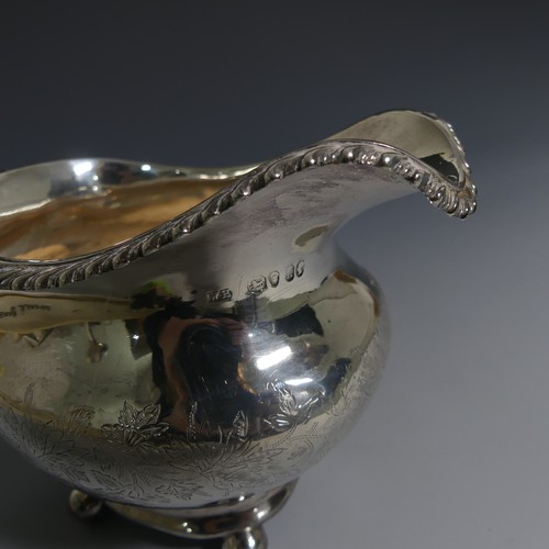 392 - A Victorian silver Cream Jug, by William Hunter, hallmarked London, 1848, of oval form with gad... 