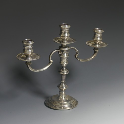 424 - An Elizabeth II silver three light candelabrum, by William Comyns & Sons Ltd., the stick hallmar... 