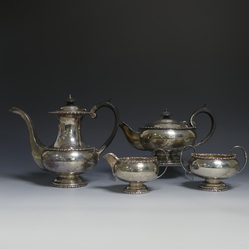 A George VI silver four piece Tea and Coffee Set, by Walker & Hall, hallmarked Sheffield, 1947/8, of circular form with moulded rims and waists, the teapot and hot water pot with ebony effect bakelite handles and finials, coffee pot 19.5cm high, approx total weight 52.9ozt  (4)
