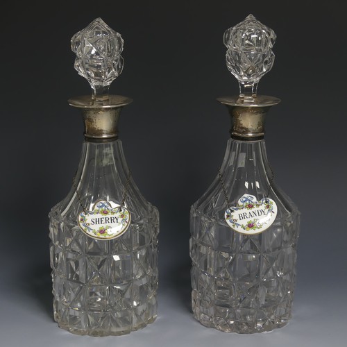 439 - A pair of George V silver mounted cut glass Decanters, by Arthur Willmore Pennington, hallmarked Bir... 