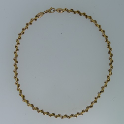 127 - A 9ct yellow gold Necklace, formed of a ropetwist chain wrapped around a polished chain, clip clasp,... 