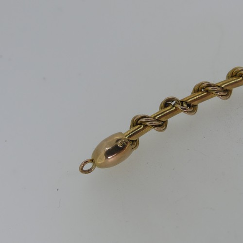 127 - A 9ct yellow gold Necklace, formed of a ropetwist chain wrapped around a polished chain, clip clasp,... 