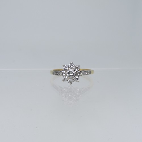 68 - A diamond flowerhead Cluster Ring, the central brilliant cut stone c.¼ct, surrounded by eight smalle... 